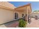 Inviting covered patio with dining set and BBQ, perfect for outdoor entertaining and relaxation at 10461 W Hutton Dr, Sun City, AZ 85351