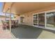 Inviting covered patio with dining set, perfect for outdoor entertaining and relaxation at 10461 W Hutton Dr, Sun City, AZ 85351