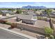 An aerial shot of a fenced in backyard and desert landscaping with mountain views at 1057 W Mesquite Ave, Apache Junction, AZ 85120