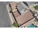 An aerial view displays the home's layout, including the roof, yard, and a partially visible swimming pool at 1057 W Mesquite Ave, Apache Junction, AZ 85120