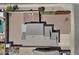 An aerial view showcases the home's roof, yard, and a swimming pool on a sunny day at 1057 W Mesquite Ave, Apache Junction, AZ 85120