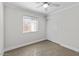 Bedroom with light walls, a ceiling fan, and closet at 1057 W Mesquite Ave, Apache Junction, AZ 85120