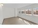 Bright, large flex room with new floors and multiple large windows at 1057 W Mesquite Ave, Apache Junction, AZ 85120