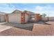 A charming single-Gathering home showcases its brick and siding facade and a well-manicured yard at 1057 W Mesquite Ave, Apache Junction, AZ 85120
