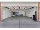 An open garage with a finished floor contains storage cabinets and water equipment at 1057 W Mesquite Ave, Apache Junction, AZ 85120