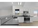 Stylish kitchen featuring quartz countertops, stainless steel appliances, and white cabinetry at 1057 W Mesquite Ave, Apache Junction, AZ 85120