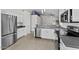 An open kitchen featuring stainless steel appliances, modern countertops, and white cabinetry at 1057 W Mesquite Ave, Apache Junction, AZ 85120