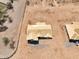 Aerial view of new construction home with partially completed roof and dirt lot at 10829 W Woodruff Rd, Casa Grande, AZ 85194