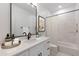 Modern bathroom with a stylish vanity, bathtub, and decorative accents at 10907 W Woodruff Rd, Casa Grande, AZ 85194