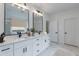 Sleek main bathroom with double vanity, marble floors, and modern fixtures at 10907 W Woodruff Rd, Casa Grande, AZ 85194