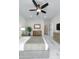 Comfortable main bedroom with neutral colors, a ceiling fan, and a serene atmosphere at 10907 W Woodruff Rd, Casa Grande, AZ 85194