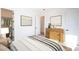 Bright bedroom features a walk-in closet, wooden dresser, and modern decor for a comfortable and stylish living space at 10947 W Woodruff Rd, Casa Grande, AZ 85194