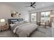 Calm bedroom with a ceiling fan, neutral decor, ample natural light and cozy textures at 10981 W Woodruff Rd, Casa Grande, AZ 85194