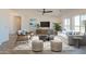 Spacious living room with abundant natural light, stylish furniture, and elegant decor at 10981 W Woodruff Rd, Casa Grande, AZ 85194