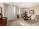 Elegant entryway featuring a tray ceiling, decorative lighting, and hardwood furniture at 11055 E Ocaso Ave, Mesa, AZ 85212