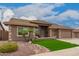 Charming home featuring manicured landscaping, a three-car garage, and a welcoming entryway at 11055 E Ocaso Ave, Mesa, AZ 85212