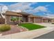 Charming home featuring manicured landscaping, a three-car garage, and a welcoming entryway at 11055 E Ocaso Ave, Mesa, AZ 85212