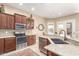 Well-equipped kitchen boasting modern appliances, granite countertops, and ample cabinet space at 11055 E Ocaso Ave, Mesa, AZ 85212