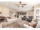 Spacious living room with open floor plan leading to kitchen and dining area at 11055 E Ocaso Ave, Mesa, AZ 85212