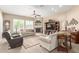 Inviting living room with fireplace, comfortable seating, and natural light at 11055 E Ocaso Ave, Mesa, AZ 85212