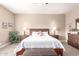 Spacious main bedroom featuring a queen bed, bedside tables, and a dresser at 11055 E Ocaso Ave, Mesa, AZ 85212