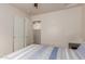 Cozy bedroom featuring a closet and an open doorway leading to an adjacent area at 11277 W Buchanan St, Avondale, AZ 85323