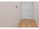 Clean entryway featuring tile flooring, a white front door, and neutral walls at 11277 W Buchanan St, Avondale, AZ 85323