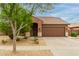 Charming single-story home featuring desert landscaping and a tile roof at 11277 W Buchanan St, Avondale, AZ 85323