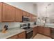 A well-equipped kitchen features granite countertops, stainless steel appliances, and ample cabinet space at 11277 W Buchanan St, Avondale, AZ 85323