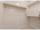 This large walk-in closet features built-in shelving and ample storage space for clothing and accessories at 11277 W Buchanan St, Avondale, AZ 85323