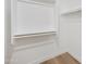 Simple, empty closet with white shelving and wooden floors at 116 W Jasper Dr, Gilbert, AZ 85233