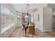 Dining room featuring a modern chandelier, large windows, and seating for six which is perfect for entertaining at 116 W Jasper Dr, Gilbert, AZ 85233