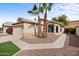 Single-story home with desert landscaping, a two car garage, and front bay window provides attractive curb appeal at 116 W Jasper Dr, Gilbert, AZ 85233