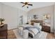 Serene main bedroom with a modern color palette, en-suite bathroom, and large windows for natural light at 116 W Jasper Dr, Gilbert, AZ 85233