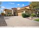 Attractive single Gathering home featuring a brick driveway and manicured landscaping at 12047 W Red Hawk Dr, Peoria, AZ 85383