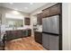 Well-lit kitchen with wood cabinets and stainless steel appliances including a large refrigerator at 12047 W Red Hawk Dr, Peoria, AZ 85383