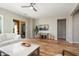 Modern living room featuring wood floors, neutral tones, and a view to a patio, great for entertaining at 12047 W Red Hawk Dr, Peoria, AZ 85383