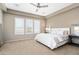 Spacious bedroom with neutral carpet and window shutters for natural light control at 12047 W Red Hawk Dr, Peoria, AZ 85383