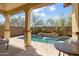 Backyard oasis featuring a private pool and patio with a seating area at 12047 W Red Hawk Dr, Peoria, AZ 85383