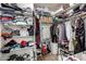 Walk-in closet featuring plenty of storage space, shelving, and wood look flooring at 12415 N 41St Dr, Phoenix, AZ 85029