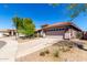 Charming home featuring a two-car garage, well-kept lawn, and desert landscaping at 12415 N 41St Dr, Phoenix, AZ 85029
