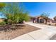 Beautiful single-story home with desert landscaping, a two-car garage, and an inviting entrance at 12415 N 41St Dr, Phoenix, AZ 85029