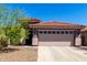 Inviting home featuring a well-maintained landscape and a classic red tile roof at 12415 N 41St Dr, Phoenix, AZ 85029