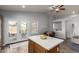 Spacious kitchen with a center island, access to the backyard, and an eat-in dining area at 12415 N 41St Dr, Phoenix, AZ 85029