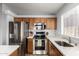 Close up of stainless steel appliances and light wood colored cabinets in the kitchen at 12415 N 41St Dr, Phoenix, AZ 85029