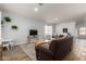 Cozy living room with neutral paint, stylish furnishings, and wood-look tile flooring at 12415 N 41St Dr, Phoenix, AZ 85029