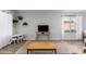 Well-lit living room featuring neutral paint, modern lighting, and open layout at 12415 N 41St Dr, Phoenix, AZ 85029
