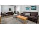 Comfortable living room featuring modern furnishings, wood-look tile, and a relaxing atmosphere at 12415 N 41St Dr, Phoenix, AZ 85029