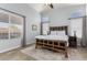 Main bedroom features a ceiling fan, natural light, and wood look flooring at 12415 N 41St Dr, Phoenix, AZ 85029