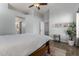Cozy main bedroom with wood look flooring and neutral colored walls at 12415 N 41St Dr, Phoenix, AZ 85029